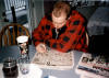 Nathan (lead guitar) tackles the morning crossword in the kitchen at the Plate Farm in Snohomish.